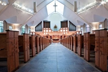 main walkway to front of church with pew ends