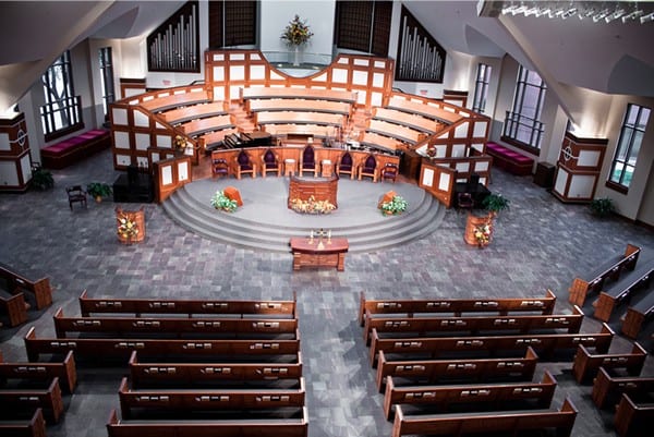 front of church from balcony with pews and stage