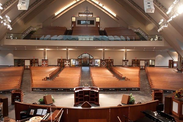 altar overlooking pews both straight and curved