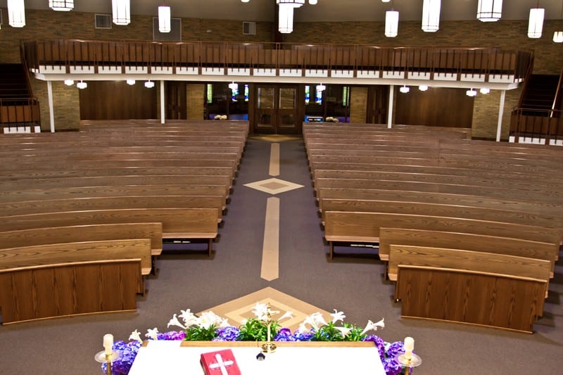 walkway with pews and bible