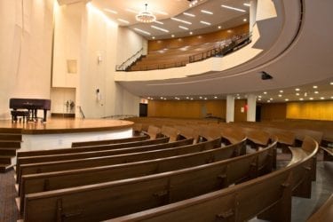 interior of church with curved pews