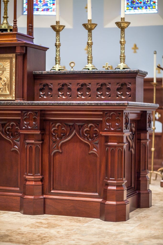 Detail of decorative wooden altar with marble top