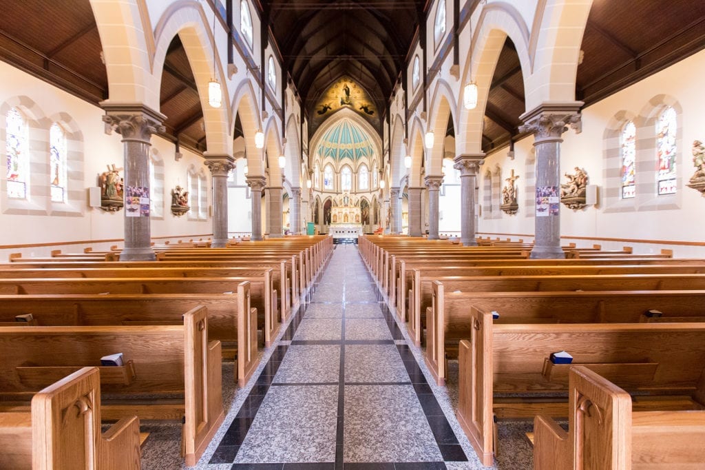 walkway with church pews and front 