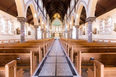 walkway with church pews and front