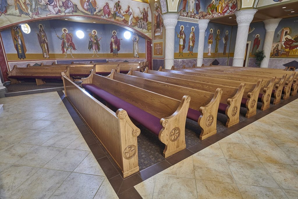 pews with maroon cushion seating