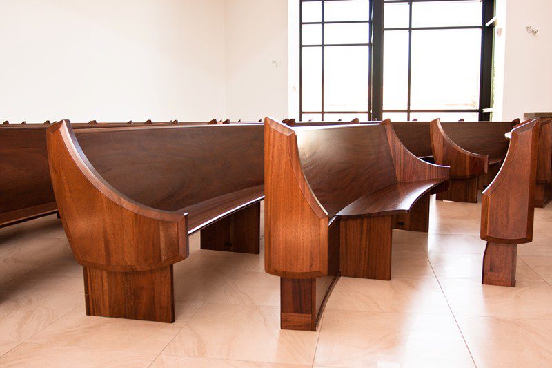 Modern church pews provide a designated space for wheelchair access