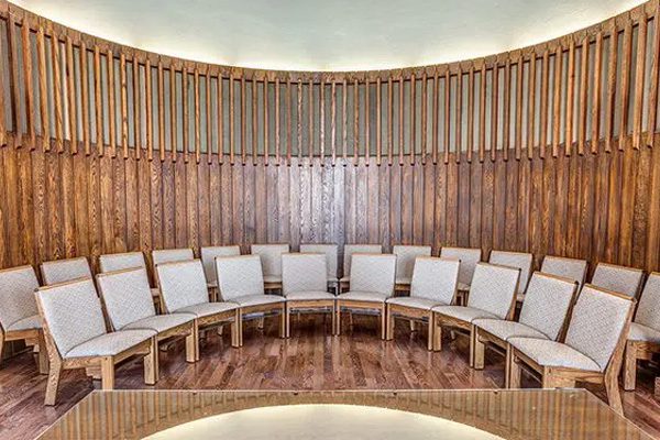 Curved rows of wooden church chairs look beautiful at St. John's United Church in Georgetown, ON.